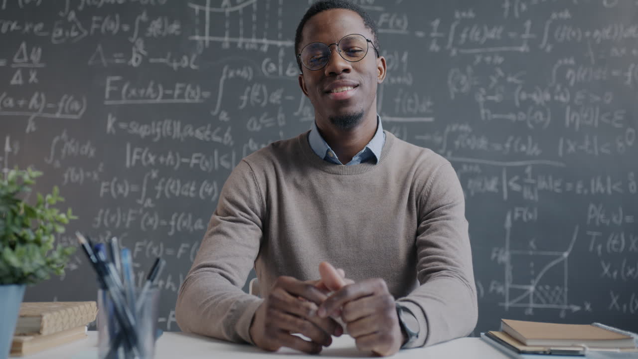 Man teaching math in a classroom