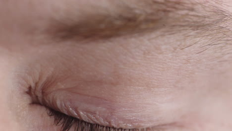 close-up-young-man-eye-opening-blinking-looking-at-camera