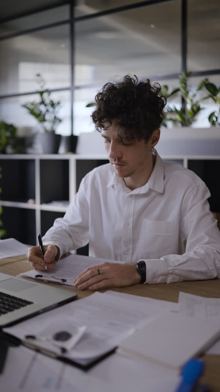Business Person Working on Documents in Modern Office