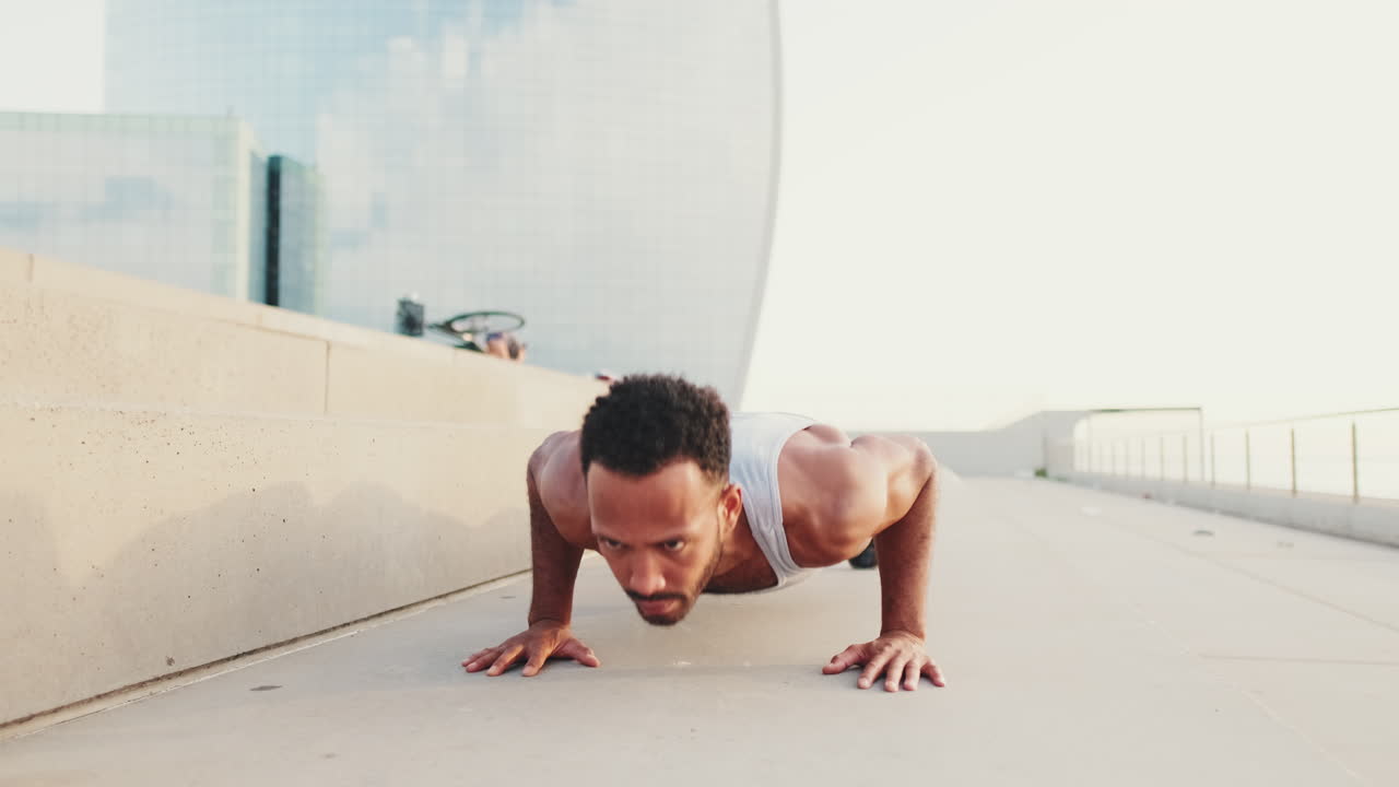 Man doing push-ups in urban setting
