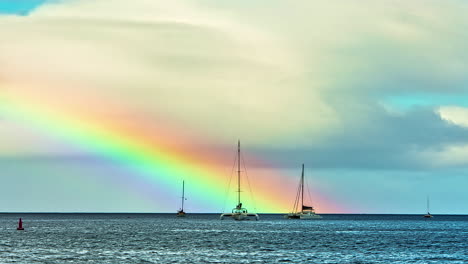 vibrant bright rainbow rise above ocean water with small boats, fusion time lapse