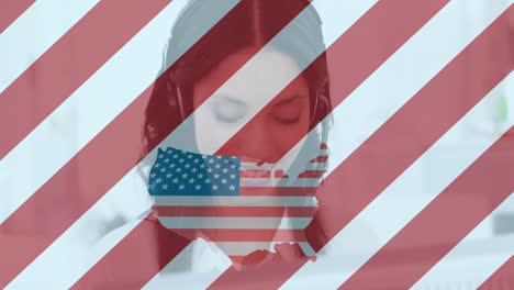 Animation-of-map-and-flag-of-usa-with-biracial-businesswoman-using-phone-headset