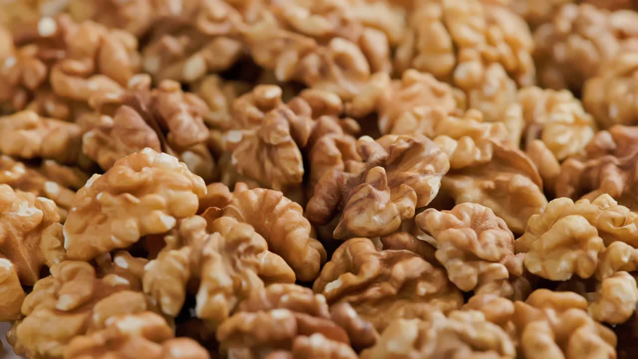 looped spinning walnuts without the shell close-up full frame background