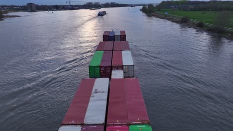 the virage cargo vessel sailing along the river in zwijndrecht, netherlands - aerial drone shot