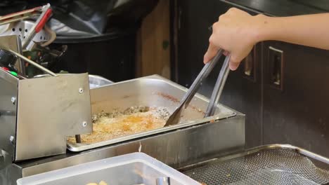 food being cooked in a deep fryer