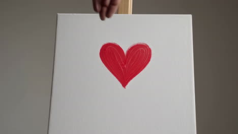 empty canvas and a painted heart