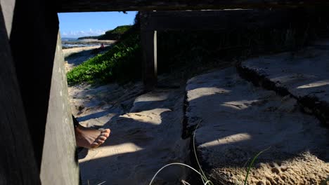 two girls walking up steps from the local beach