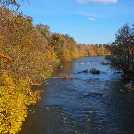 fantastic picture of the flowing river among the forest. colorful trees on a sunny autumn day. aerial nature view