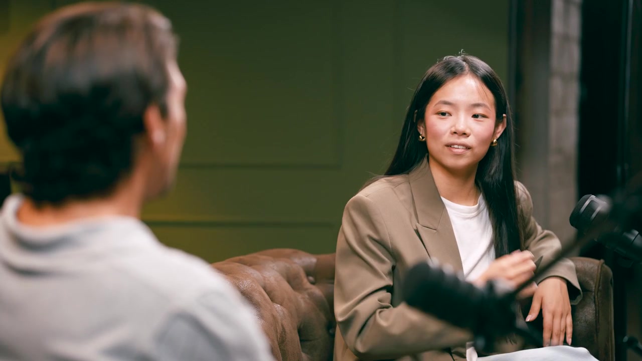 Young Woman Participating in a Podcast Interview in a Studio