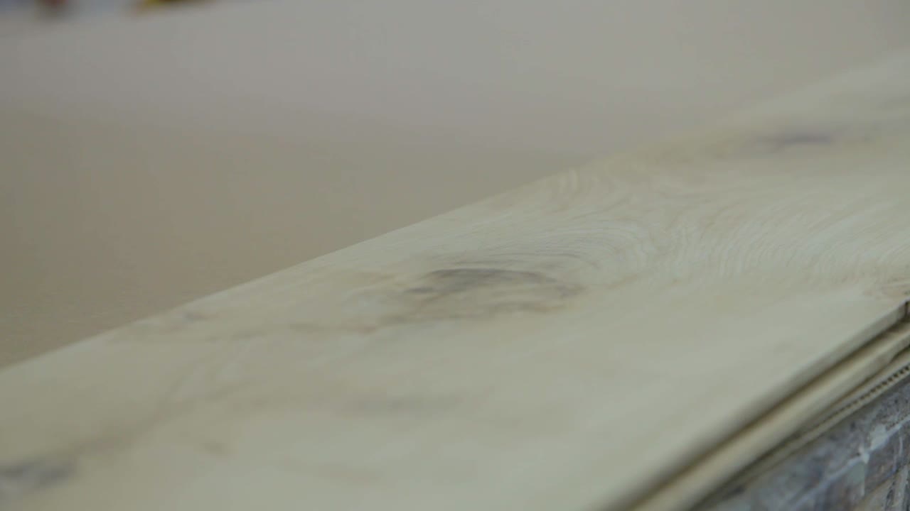Wood Board is Sanded Down by Hand in Workshop Factory