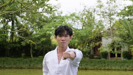 young man practising taekwondo