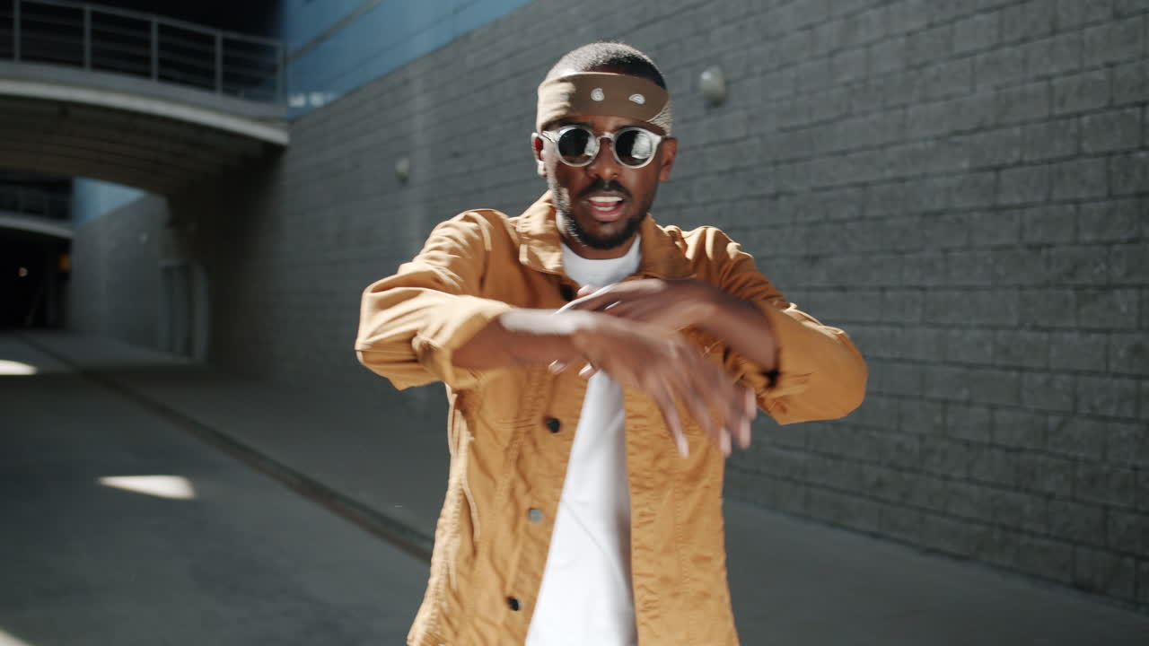 Stylish Man Dancing in Urban Setting
