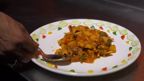 spoon put on a plate for eating pasta