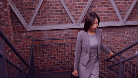 businesswoman walking with briefcase