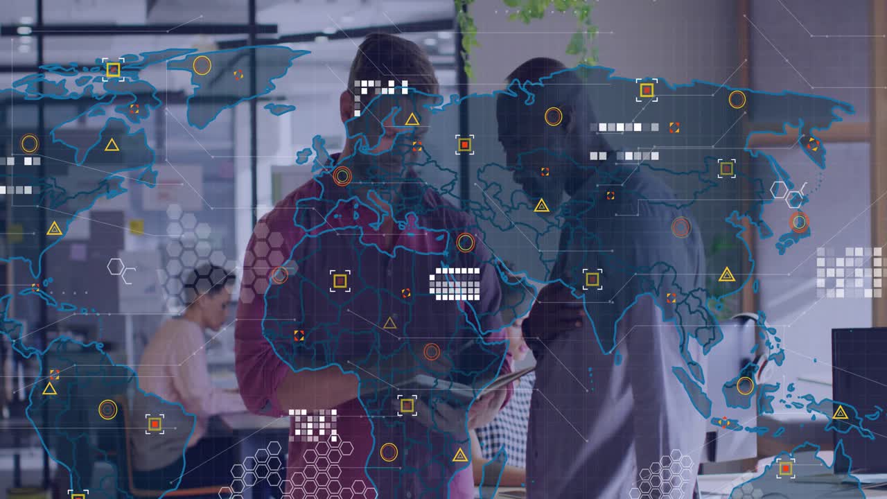 Colleagues pointing at notebook writing insights as tech world map overlay filling with data icons