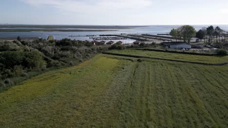 scenic aerial of cais do bico with docked boats, murtosa, aveiro
