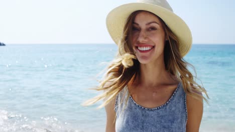 Portrait-of-beautiful-woman-enjoying-at-beach