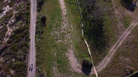 aerial view over the old quinns rocks caravan park site perth, with walkers on coastal footpath