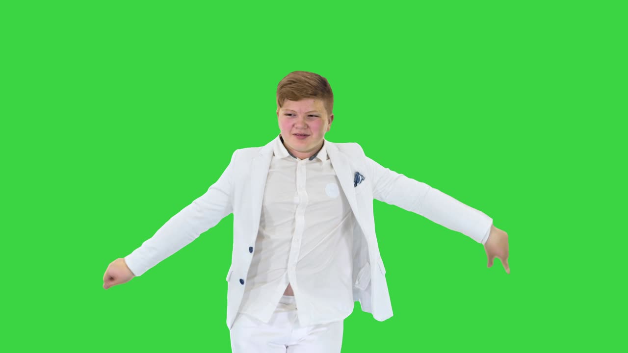 Boy in white suit dancing on a Green Screen, Chroma Key