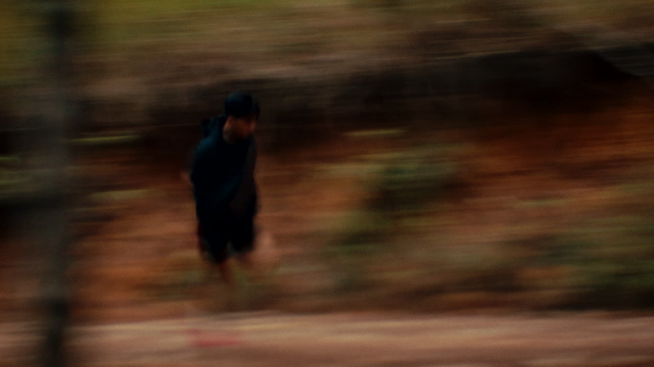Runner in a Forest Trail