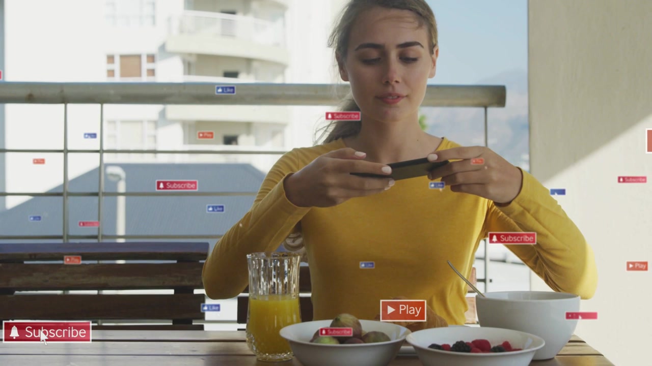 Woman tapping phone on balcony table, scrolling and rotating phone to engage social media tags