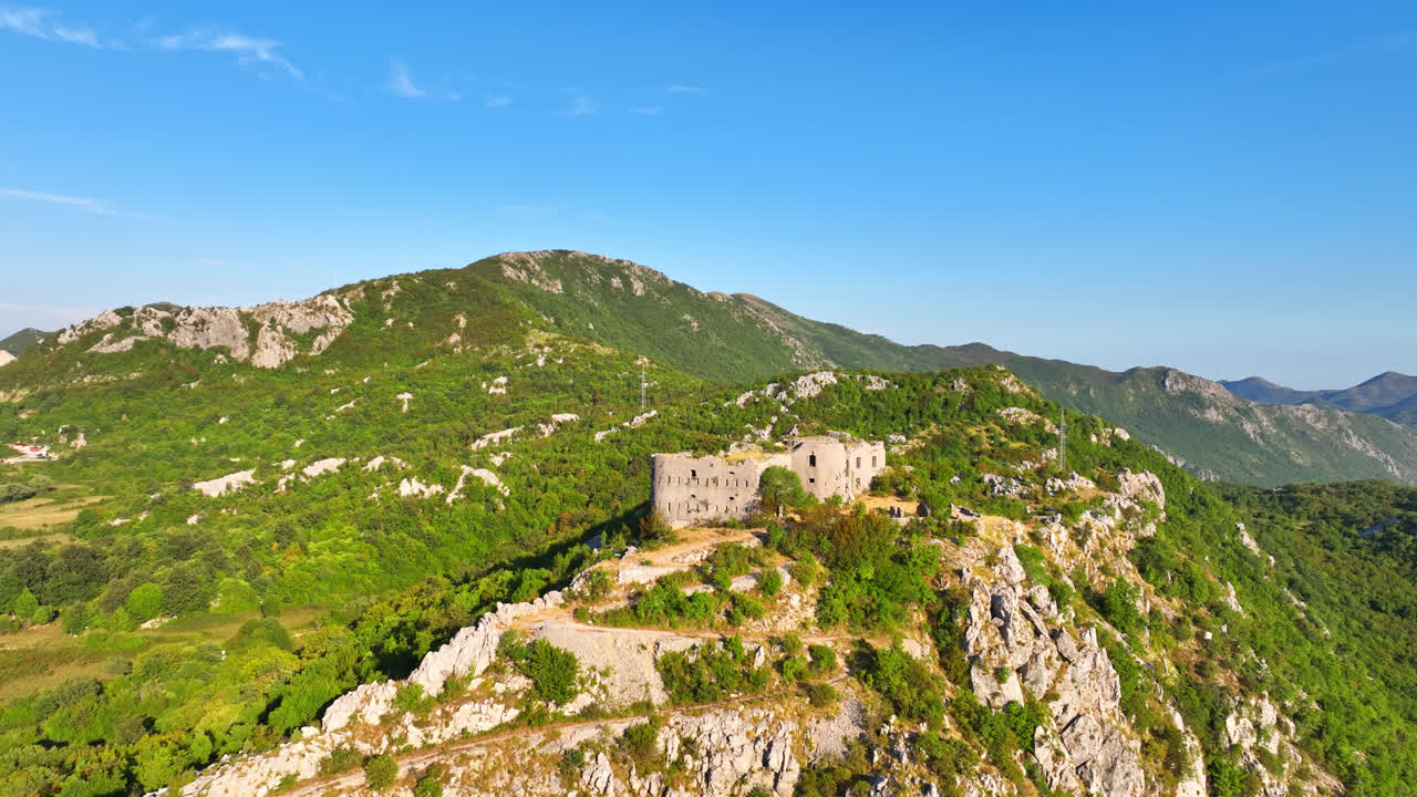 Ancient Fortress on a Green Mountain Landscape