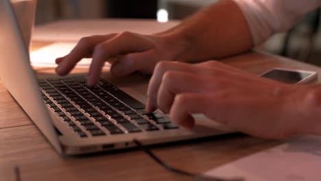 Close-up-of-human-hands-typing-on-laptop