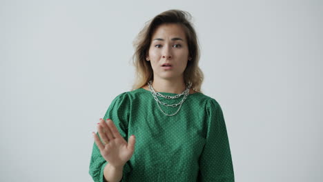 woman expressing disagreement or rejection