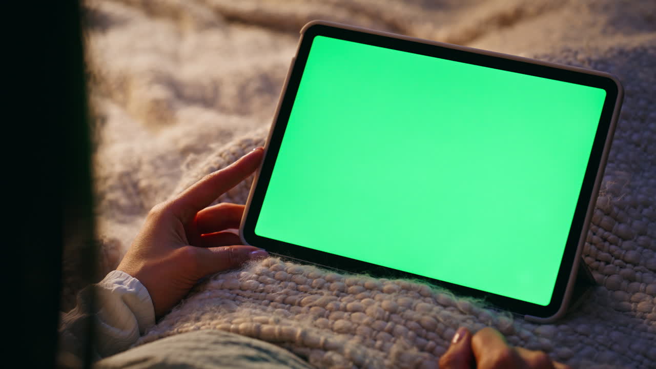 Fingers touching chromakey tablet making online purchase in home bed closeup