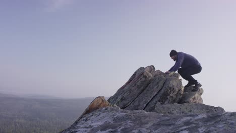 man on a mountain summit