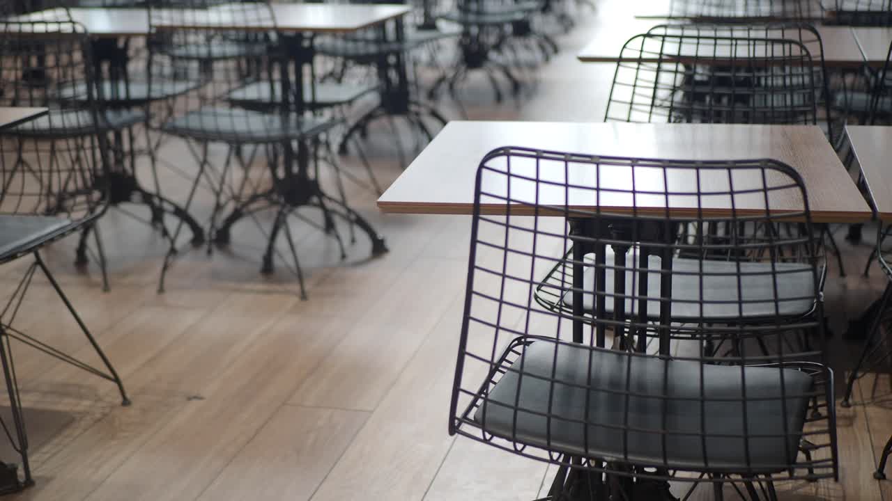 Empty Restaurant Tables and Chairs