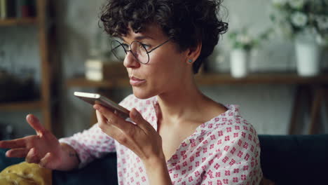 woman talking on phone at home