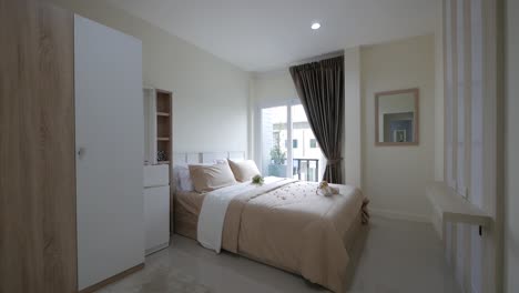 minimal white and beige bedroom decoration with double bed