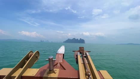 james bond island in the distance from the boat in the gulf of thailand in phuket