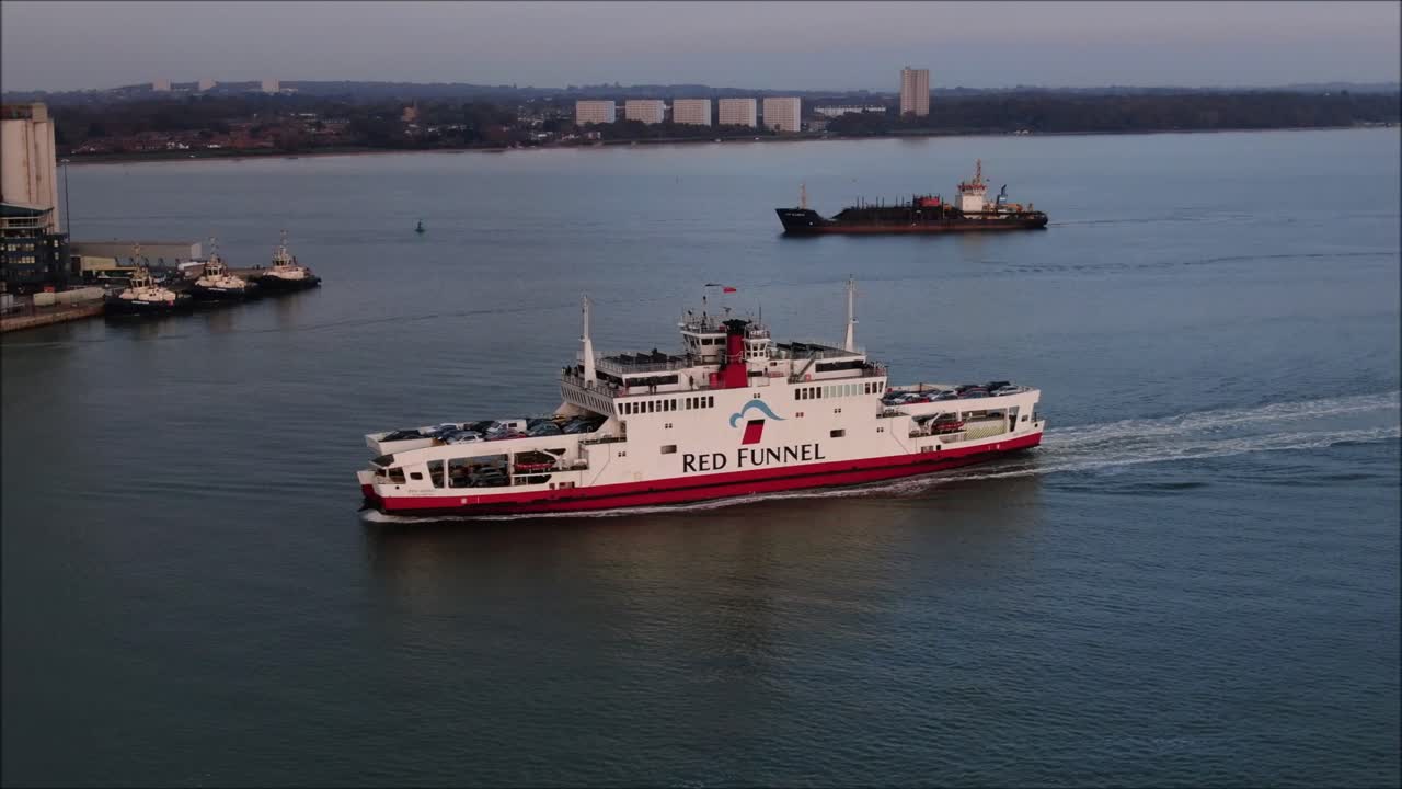 Isle of Wight red Funnel Ferry moving towards Southampton. Sailing from Cowes. Car ferry aerial shot.