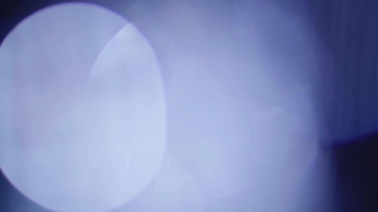 Blue Light Leaks and Bokeh Lens Flares on Black Background