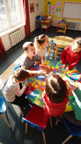 happy children engaged in puzzle activity in a preschool classroom