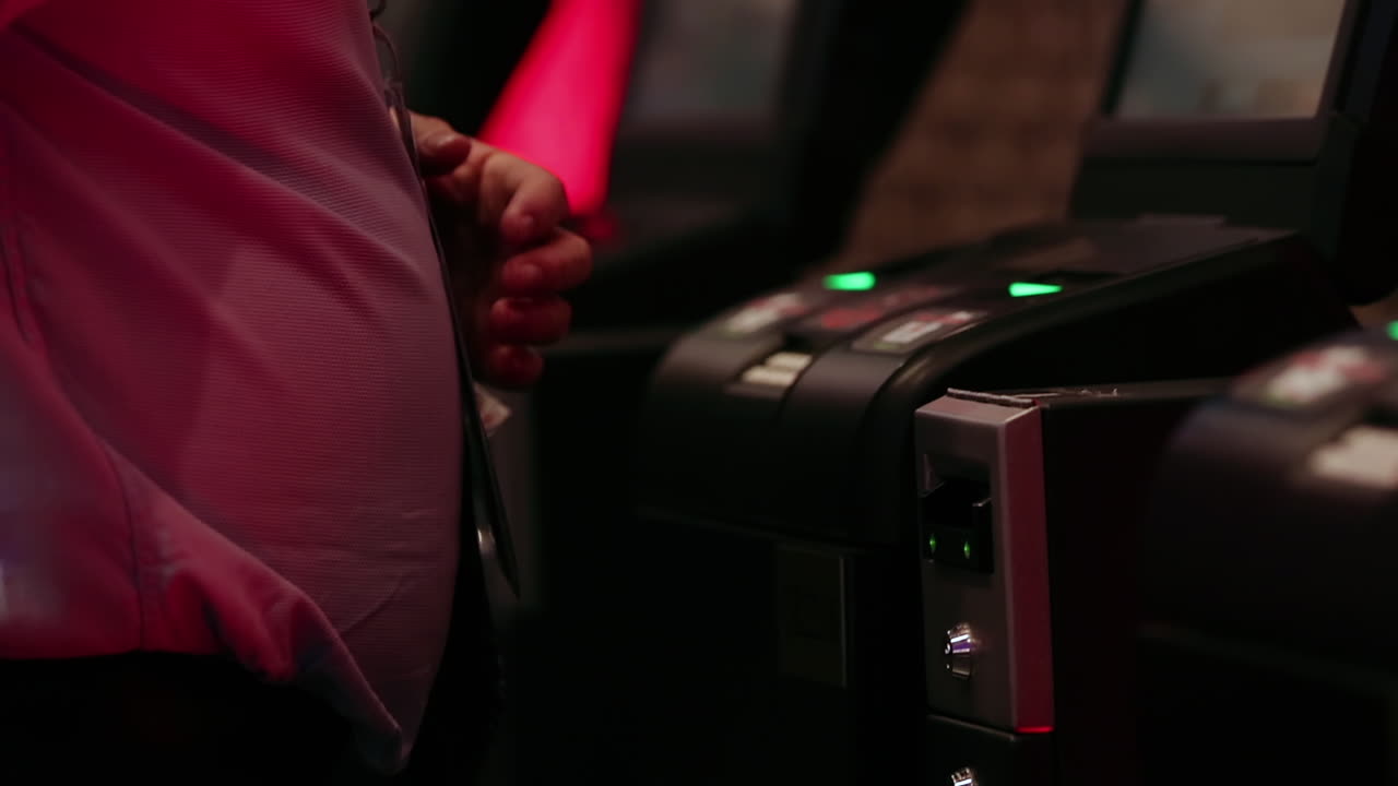 Man using electronic betting machine in slow motion