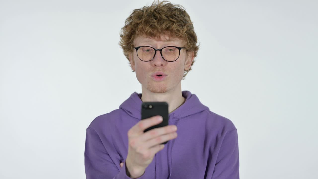 Redhead Young Man Using Smartphone, White Background