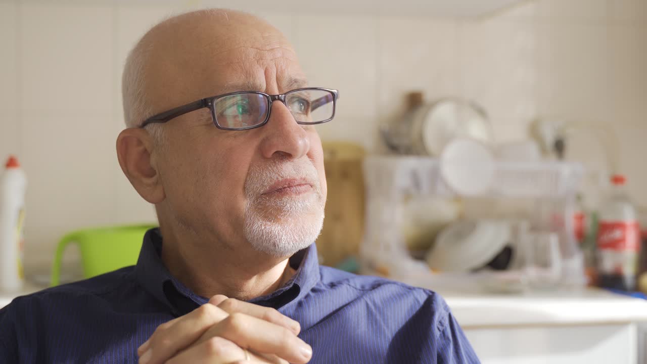 The old man is thoughtful and stressed.