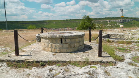 stone well at historic ovech fortress near provadia in bulgaria. - closeup shot