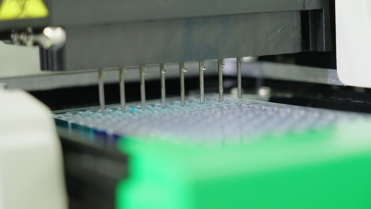 Automated Machine Filling Micro Plate With Liquid In Medical Science Laboratory, 4K Close Up