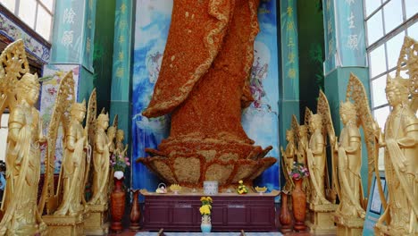 buddhist statue made of flowers at linh phuoc pagoda temple in vietnam, southeast asia