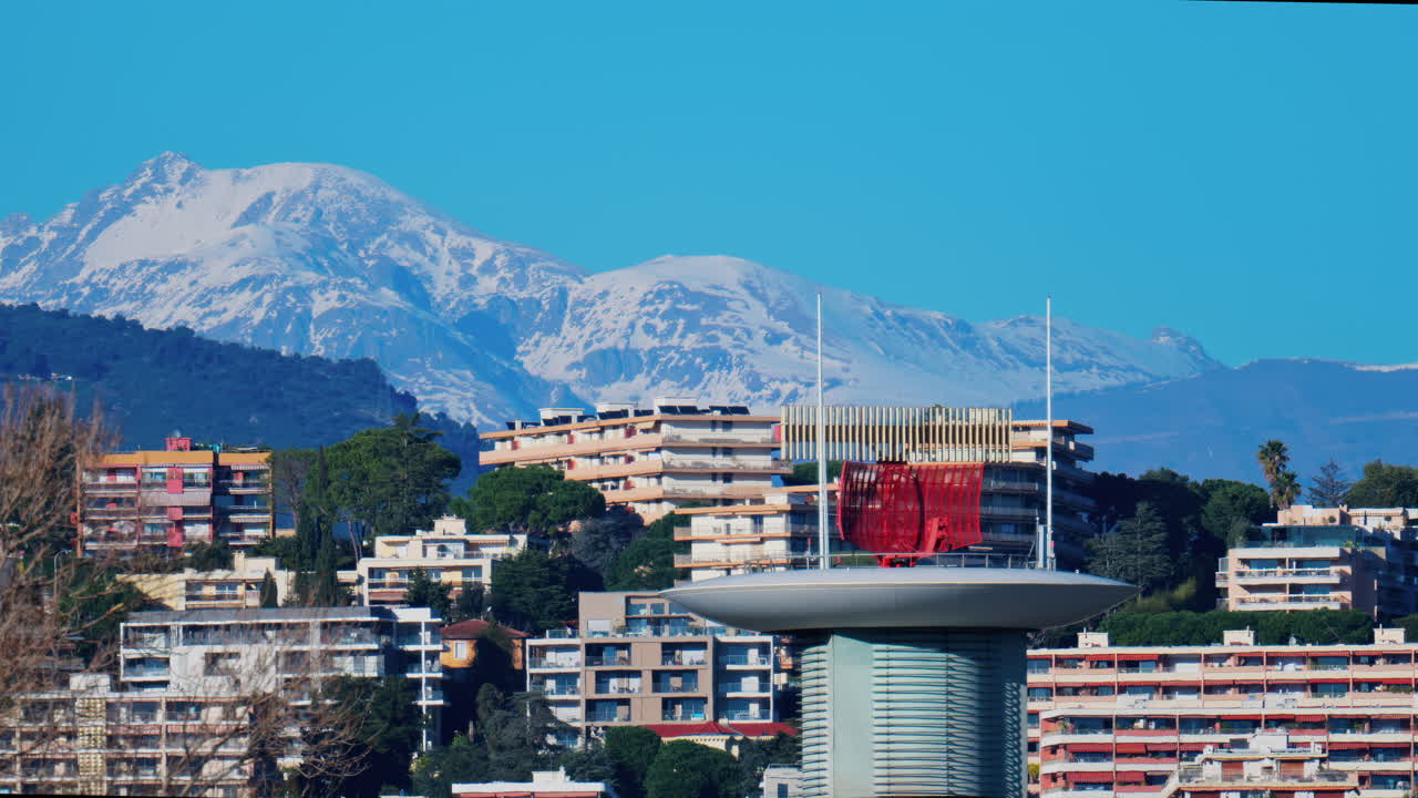 View of the radar antenna at Nice airport, France, mountains in the background