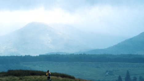 hiker enjoying the misty mountain view