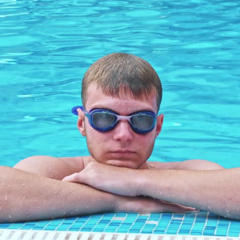 happy young man at swimming pool.