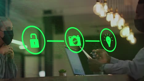 animation of flowchart of icons over diverse coworkers wearing mask and discussing reports
