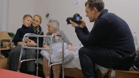 family coming to visit elderly grandma in the hospital