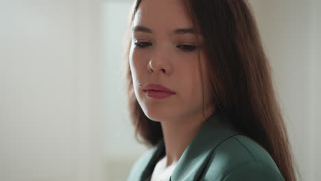 young woman feels stress at home closeup. upset lady with loose brown hair has obsessive thoughts at work. office worker with burnout of overloads