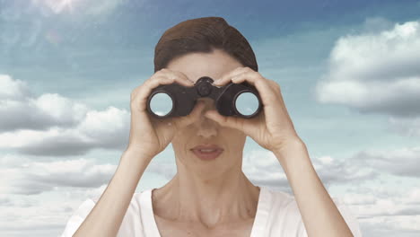 Businesswoman-looking-through-binoculars-against-sky